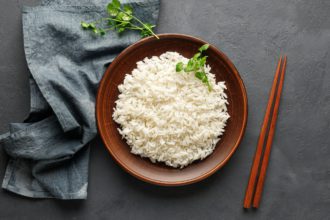 Boiled rice in a brown plate