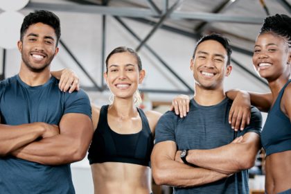 Fitness smile and portrait of friends in gym for teamwork, support and workout. Motivation, coachin