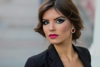 Portrait of a young female model with beautiful makeup and hairstyle